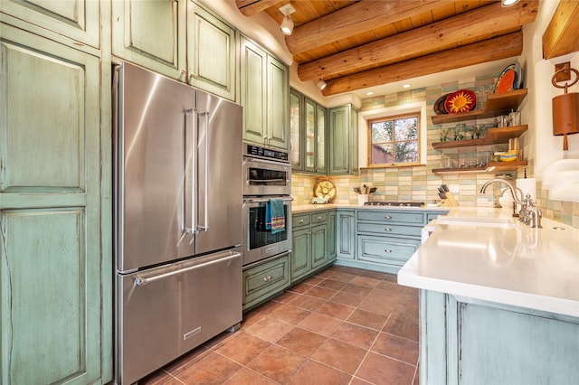 kitchen featuring decorative backsplash, wood ceiling, stainless steel appliances, beamed ceiling, and tile patterned flooring