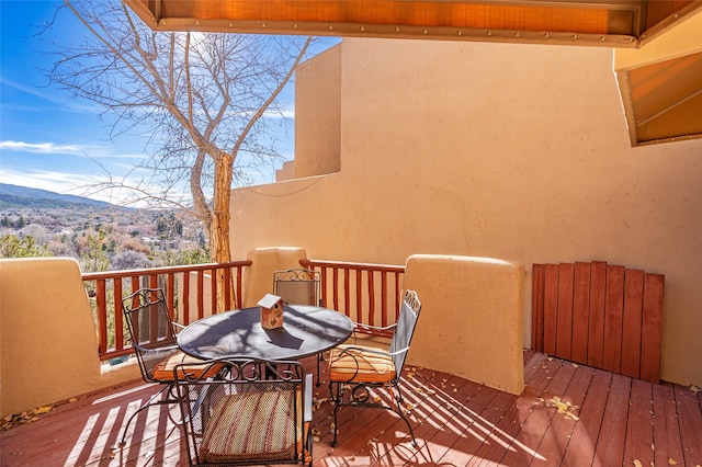 balcony with a deck with mountain view and radiator