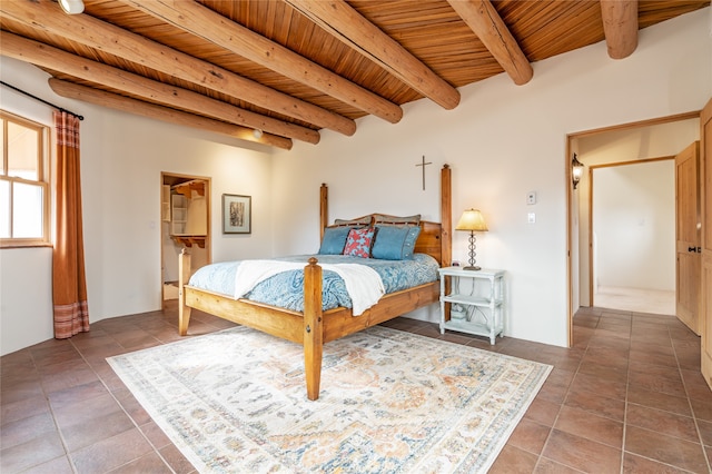 tiled bedroom with beam ceiling and wooden ceiling