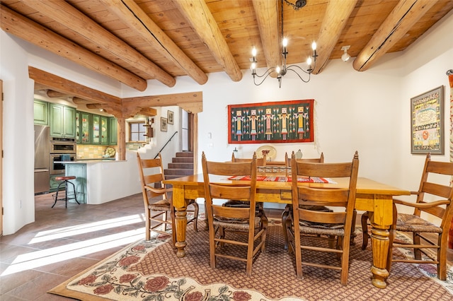 tiled dining area featuring beamed ceiling, a chandelier, and wooden ceiling