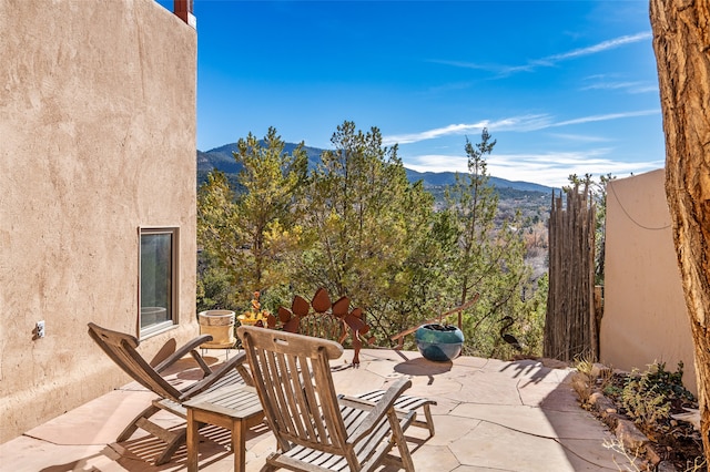 view of patio / terrace with a mountain view