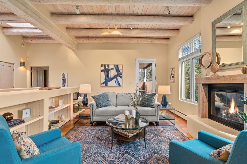 living room featuring baseboard heating, wooden ceiling, beamed ceiling, and wood-type flooring