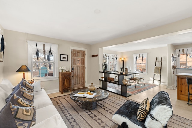 living room featuring a wealth of natural light and light hardwood / wood-style floors