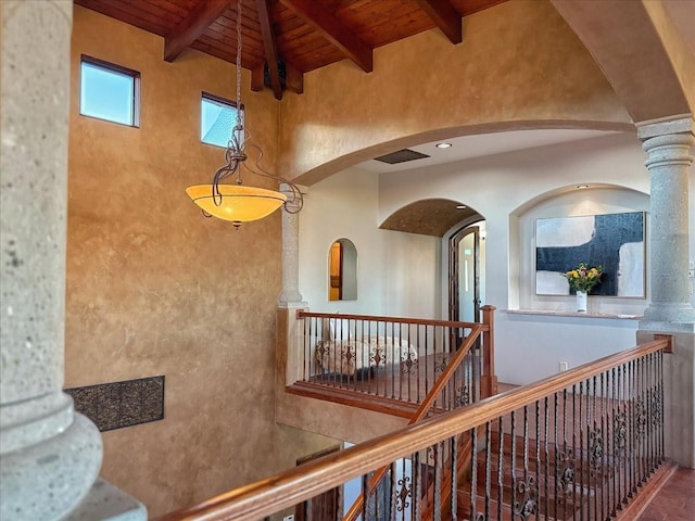 corridor with lofted ceiling with beams and wooden ceiling