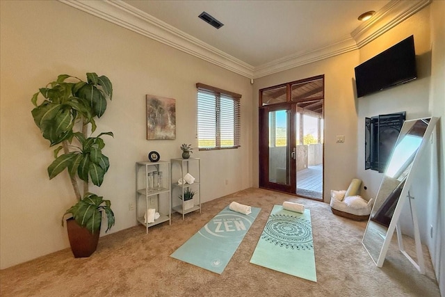 doorway with light colored carpet, crown molding, and french doors