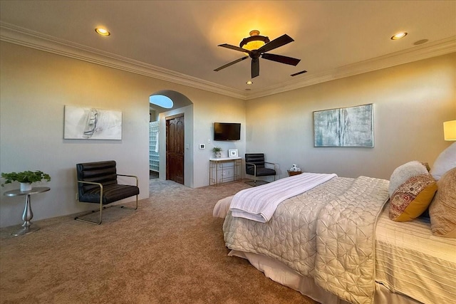 carpeted bedroom with ceiling fan and crown molding