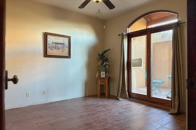 unfurnished room featuring ceiling fan and hardwood / wood-style floors