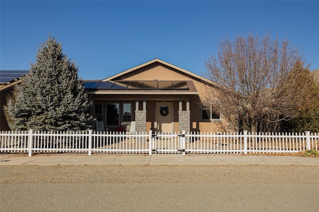 view of front of house featuring solar panels