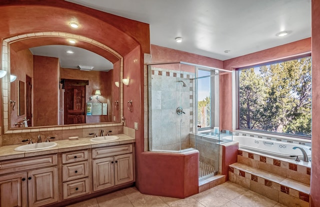 bathroom featuring tile patterned floors, vanity, and independent shower and bath