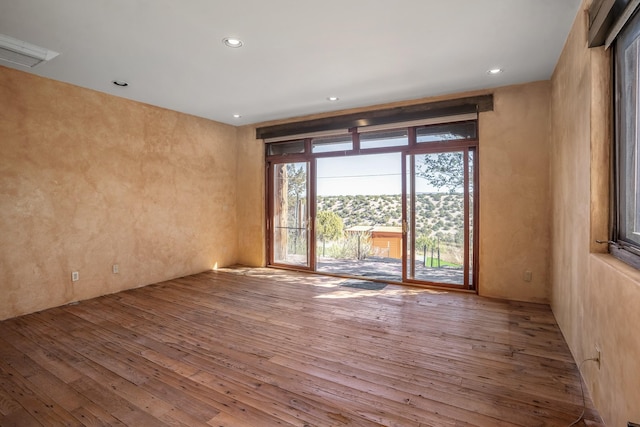 empty room with wood-type flooring