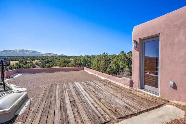 wooden terrace featuring a mountain view