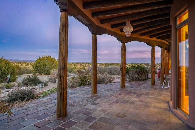 view of patio terrace at dusk