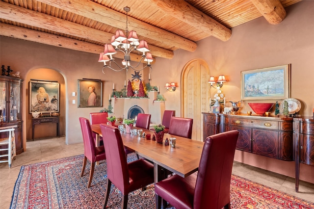 tiled dining space featuring an inviting chandelier, beamed ceiling, and wooden ceiling