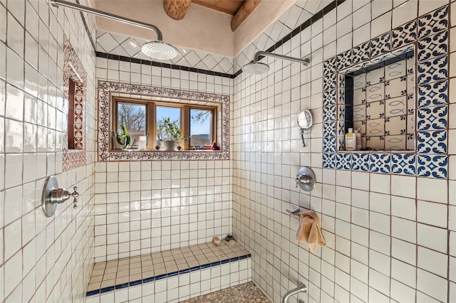 bathroom with tiled shower