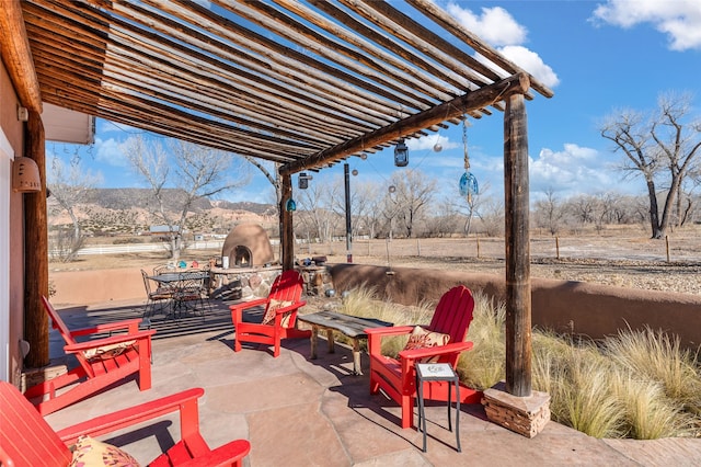 view of patio / terrace featuring a mountain view