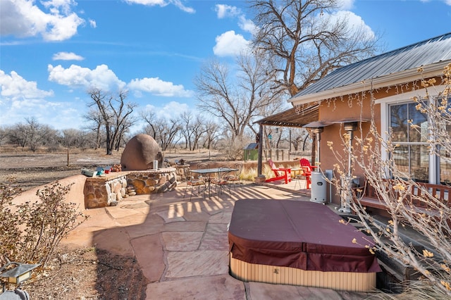 view of patio with a covered hot tub