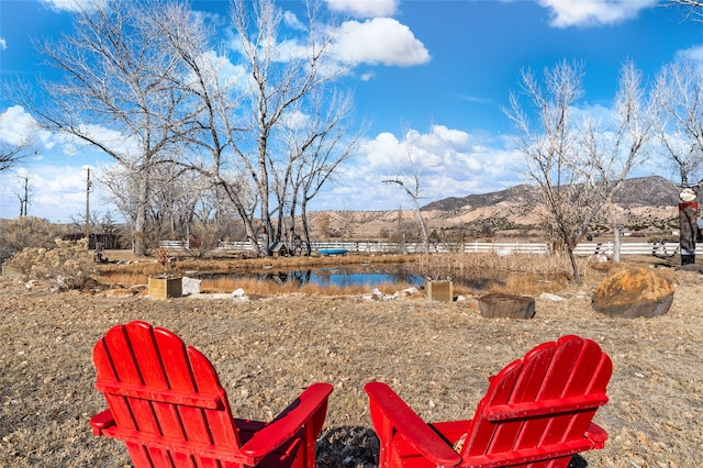 view of yard with a water and mountain view