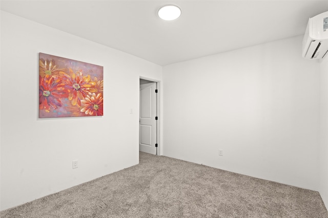 carpeted empty room with a wall unit AC