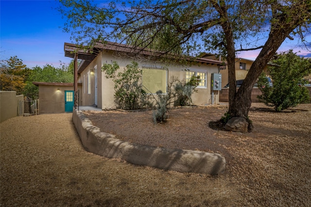 view of property exterior at dusk