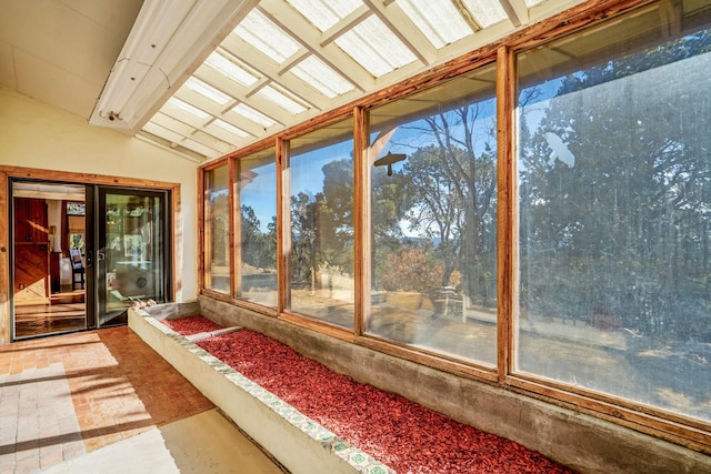 unfurnished sunroom with vaulted ceiling