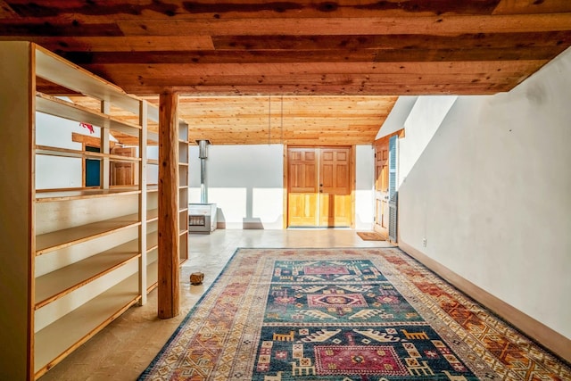 hall with vaulted ceiling with beams and wooden ceiling