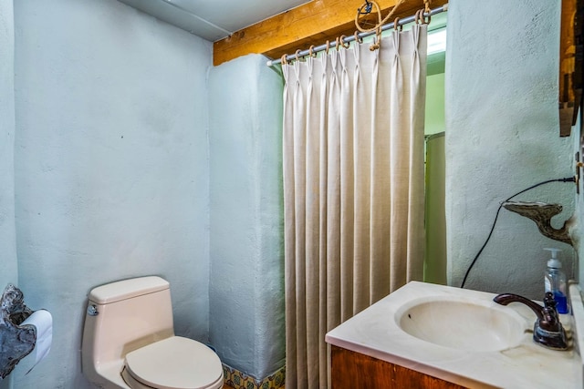 bathroom featuring sink and toilet