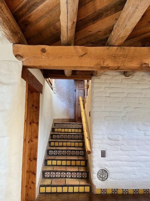 stairs with vaulted ceiling with beams and wood ceiling