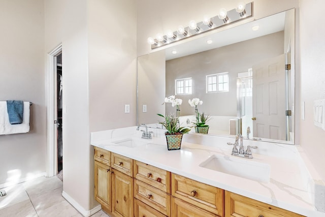 bathroom featuring vanity, tile patterned floors, and an enclosed shower