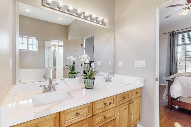 bathroom featuring wood-type flooring, vanity, ceiling fan, and independent shower and bath