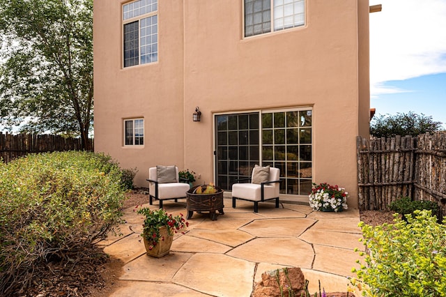 view of patio featuring an outdoor fire pit