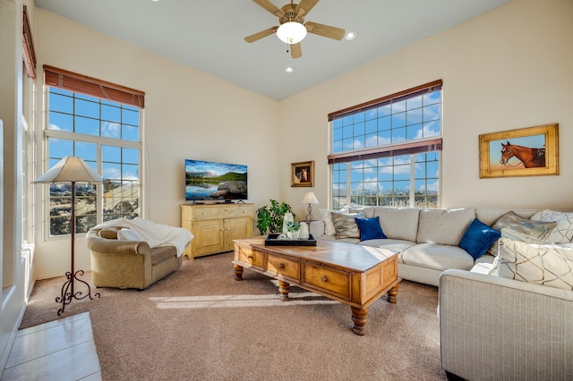 living room with carpet, ceiling fan, and a healthy amount of sunlight