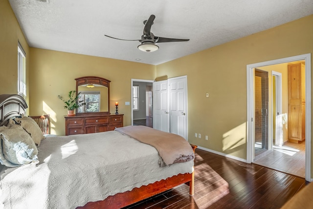 bedroom featuring a textured ceiling, ceiling fan, and dark hardwood / wood-style floors