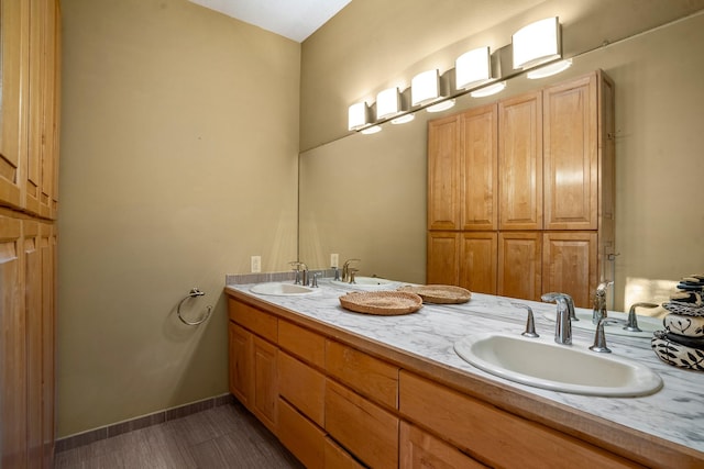 bathroom with tile patterned flooring and vanity