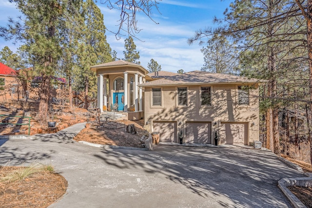 view of front of property with a garage