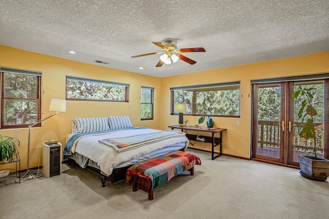 bedroom with light carpet, a textured ceiling, access to outside, and ceiling fan