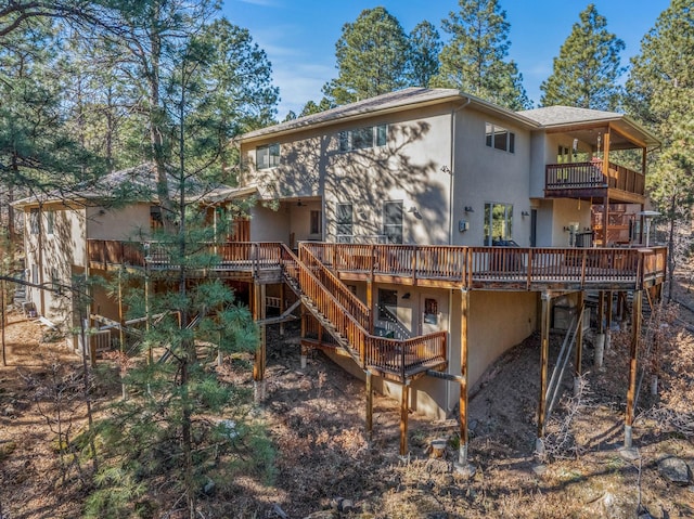 back of house with a wooden deck