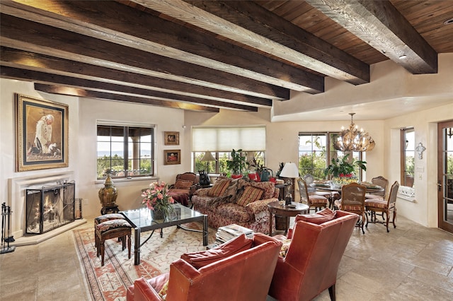 living room with beamed ceiling, a chandelier, plenty of natural light, and wood ceiling