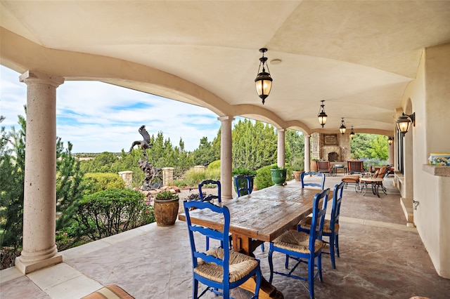 view of patio / terrace featuring an outdoor fireplace