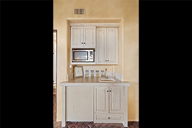 kitchen with stainless steel microwave and sink