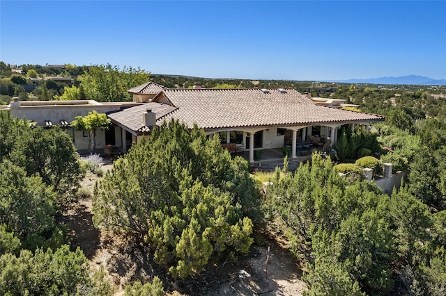 birds eye view of property featuring a mountain view