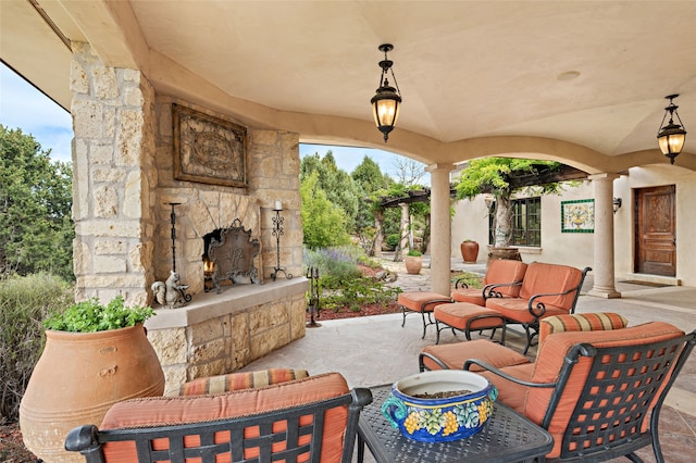 view of patio / terrace with an outdoor stone fireplace