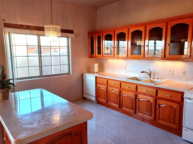 kitchen featuring light countertops, brown cabinetry, glass insert cabinets, a sink, and dishwasher