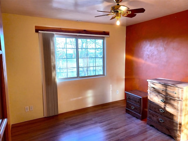 unfurnished bedroom featuring ceiling fan and wood finished floors