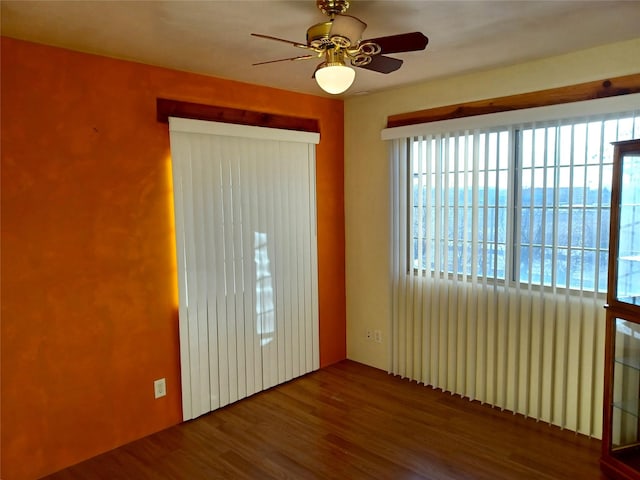 spare room featuring a ceiling fan and wood finished floors