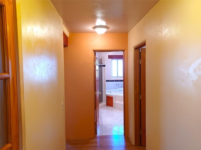 hallway with light tile patterned floors