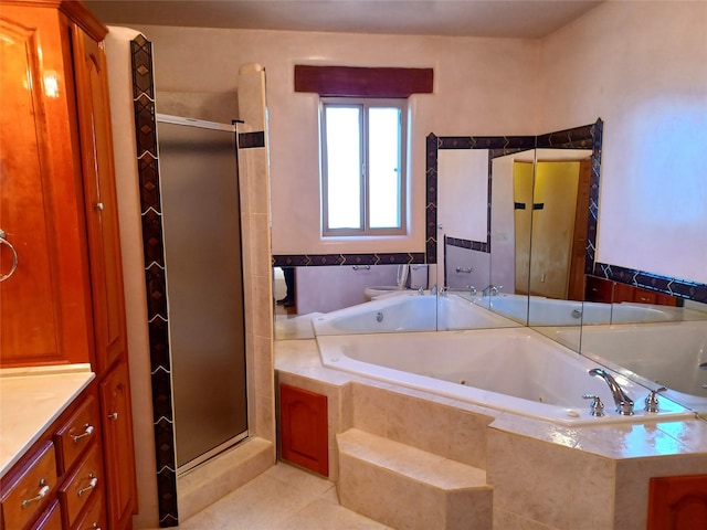 full bathroom with tile patterned floors, vanity, separate shower and tub, and toilet