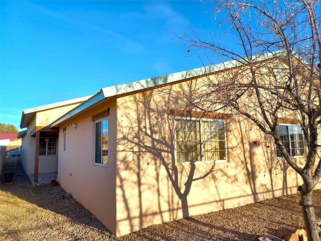 view of home's exterior with stucco siding