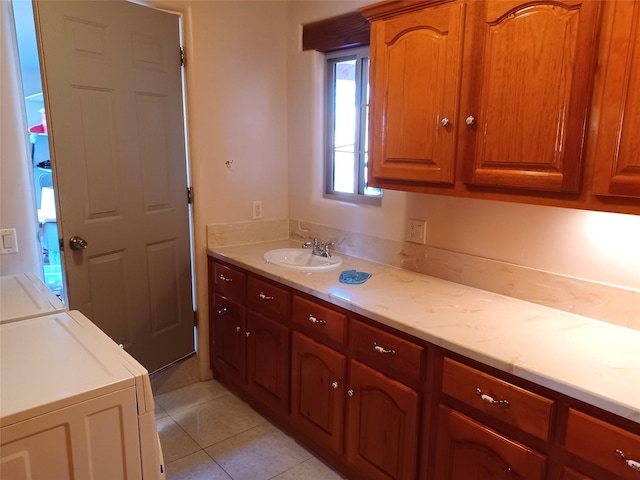 bathroom featuring tile patterned flooring and vanity