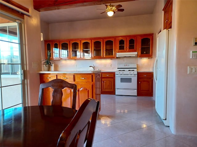 kitchen featuring backsplash, white appliances, ceiling fan, light tile patterned floors, and beam ceiling