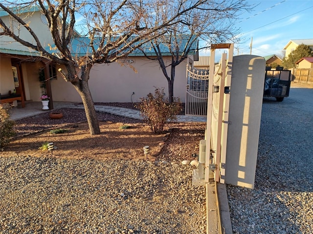 exterior space with fence and a gate